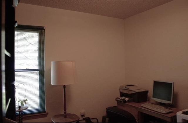 office space with a textured ceiling