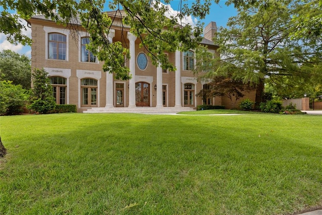 rear view of house with a lawn