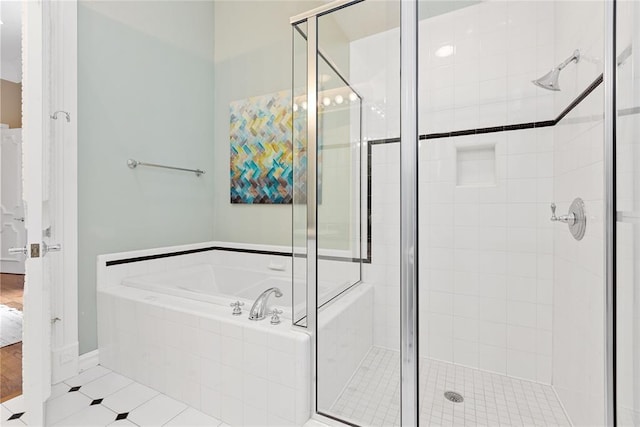 bathroom featuring tile patterned floors and plus walk in shower