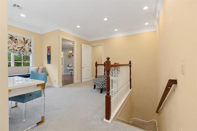 carpeted bedroom with crown molding and a chandelier