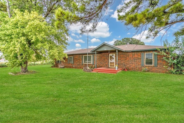 single story home with a front yard