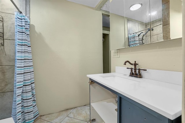 bathroom featuring tile patterned flooring, vanity, and a shower with shower curtain