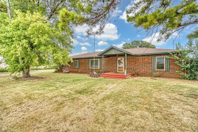 ranch-style home with a front lawn