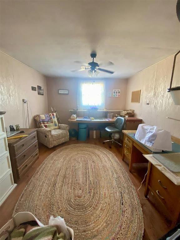 interior space featuring wood-type flooring and ceiling fan