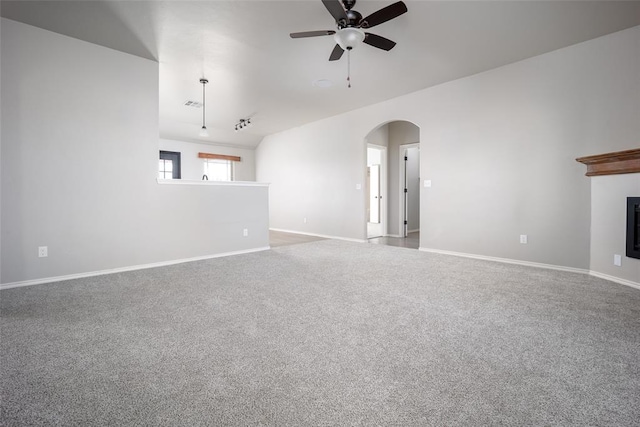 unfurnished living room featuring ceiling fan