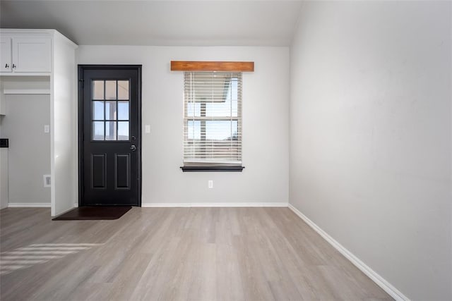 foyer with light wood-type flooring