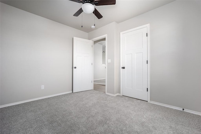 unfurnished bedroom with carpet flooring and ceiling fan