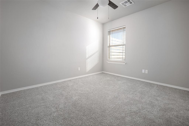 unfurnished room featuring carpet and ceiling fan