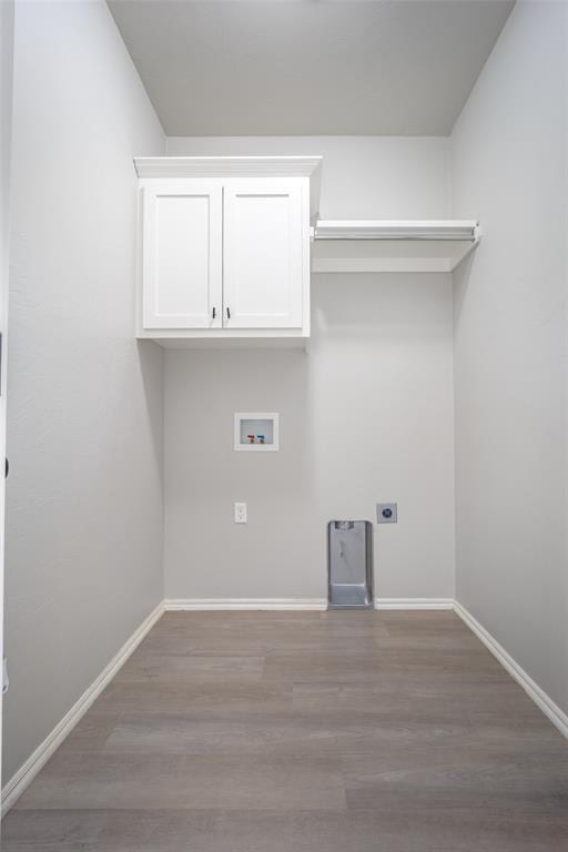 laundry area featuring washer hookup, hookup for an electric dryer, and light hardwood / wood-style floors