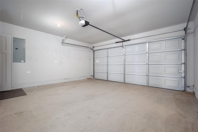 garage with a garage door opener and electric panel