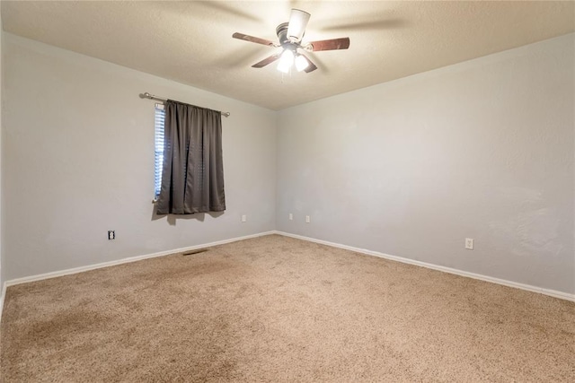 empty room with carpet and ceiling fan