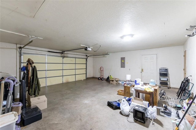 garage featuring electric panel and a garage door opener