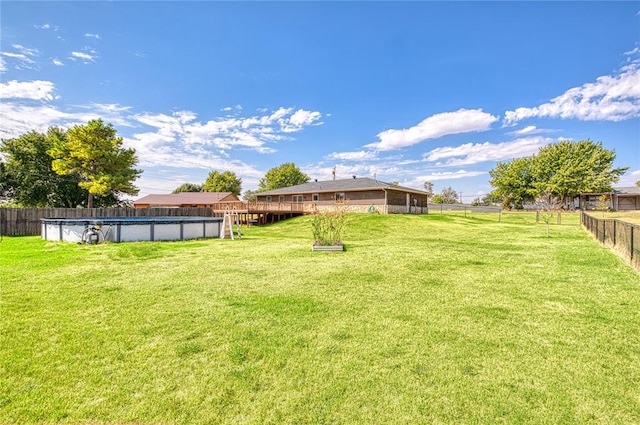 view of yard featuring a fenced in pool