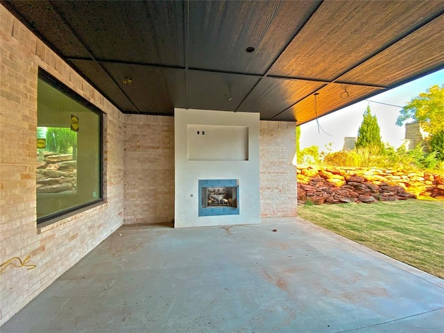 view of patio / terrace featuring exterior fireplace