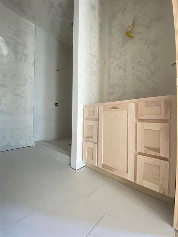 bathroom with tile patterned flooring