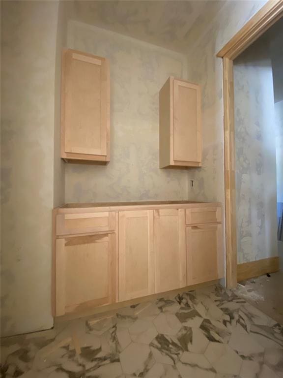 kitchen featuring light brown cabinetry