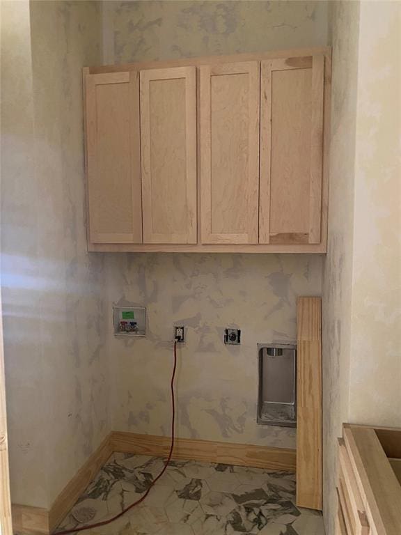 clothes washing area with electric dryer hookup, cabinets, and washer hookup