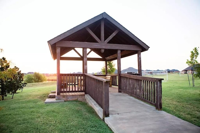 exterior space featuring a lawn and a gazebo