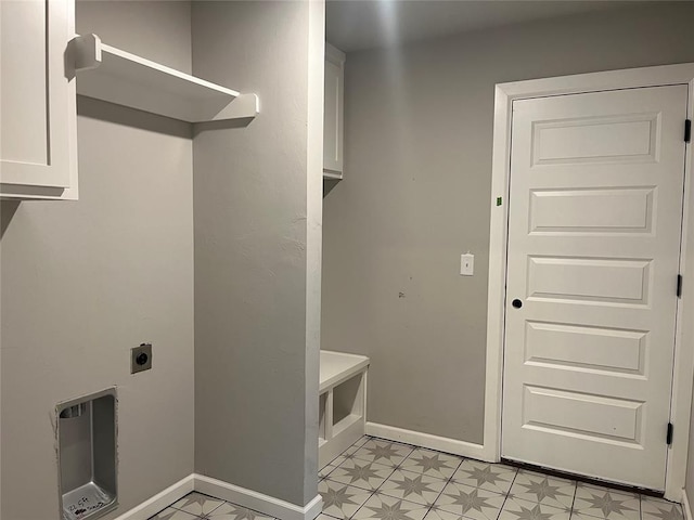 laundry area with cabinets and hookup for an electric dryer