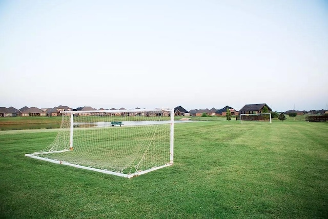 surrounding community featuring a water view