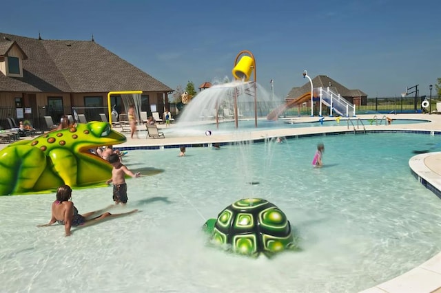 view of swimming pool featuring a water slide