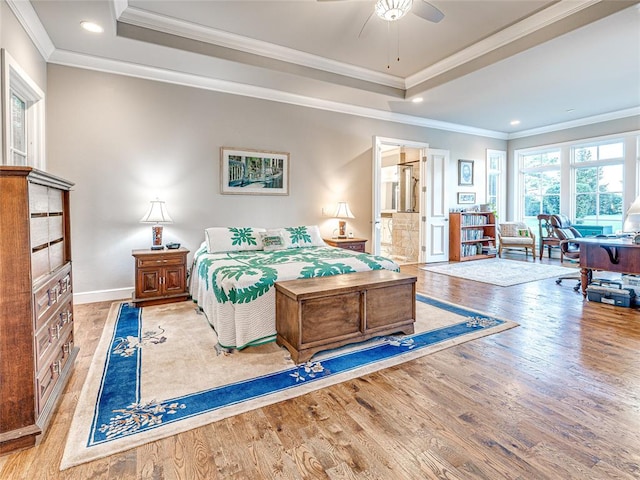 bedroom featuring light hardwood / wood-style floors, ceiling fan, and crown molding