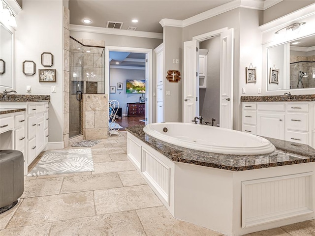 bathroom with crown molding, vanity, and an enclosed shower