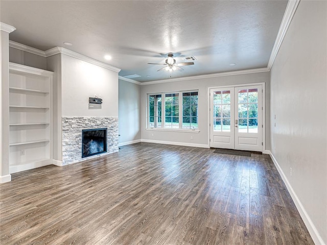 unfurnished living room featuring a fireplace, hardwood / wood-style floors, ceiling fan, and ornamental molding