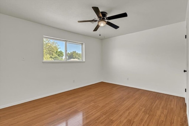 spare room featuring ceiling fan and light hardwood / wood-style floors