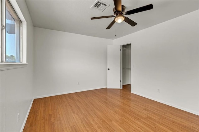 unfurnished room featuring ceiling fan and light hardwood / wood-style floors