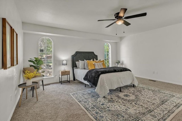 carpeted bedroom featuring ceiling fan