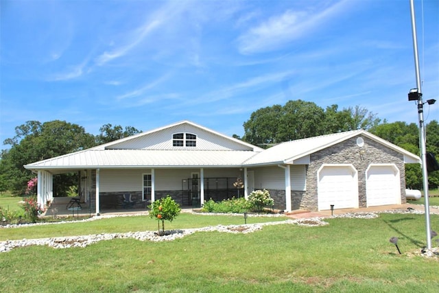 view of front facade with a porch, a garage, and a front lawn