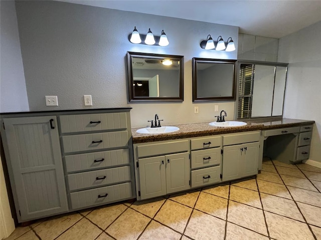 bathroom featuring tile patterned floors, vanity, and an enclosed shower