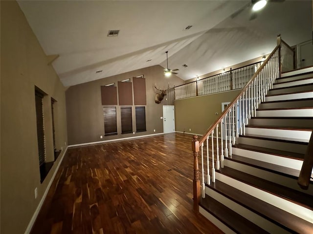 unfurnished living room with ceiling fan, high vaulted ceiling, and hardwood / wood-style flooring