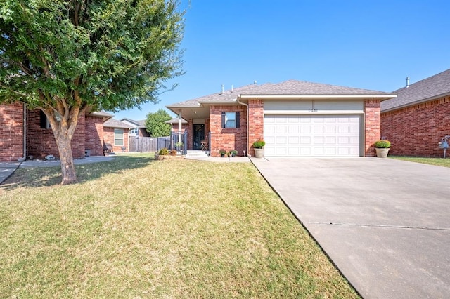 view of front of house with a front yard and a garage