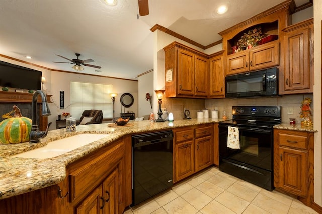 kitchen with sink, tasteful backsplash, light tile patterned flooring, black appliances, and ornamental molding