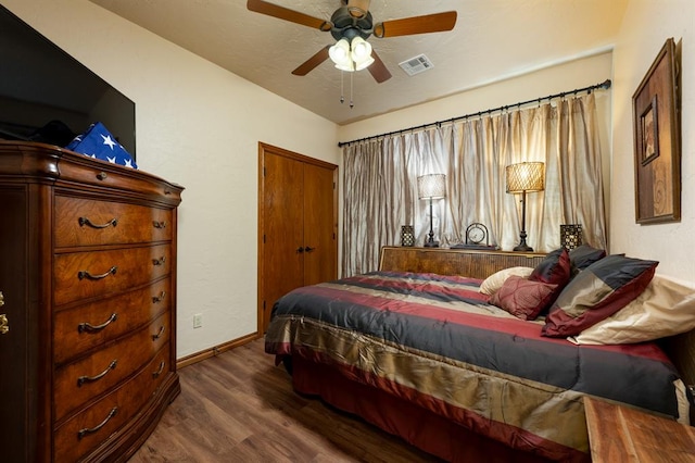 bedroom featuring ceiling fan and dark hardwood / wood-style floors