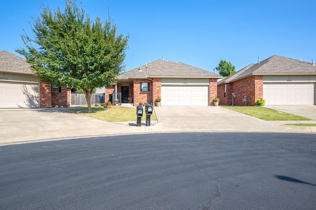 single story home with a garage and a front lawn