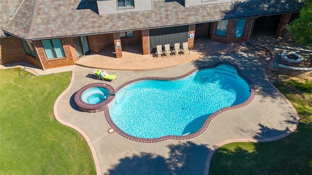 view of pool featuring an in ground hot tub and a patio