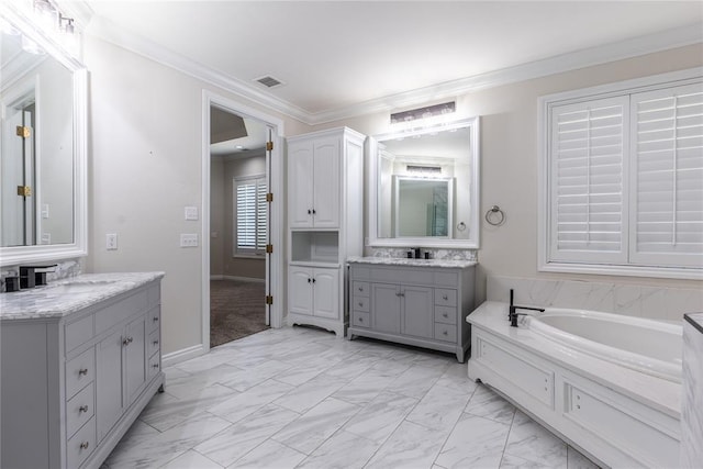 bathroom with vanity, ornamental molding, and a bath