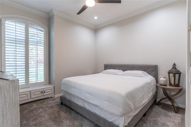 carpeted bedroom featuring ceiling fan and crown molding