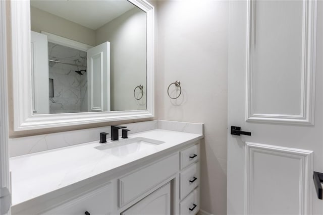 bathroom featuring vanity and a shower