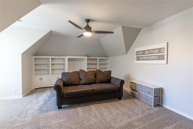 carpeted living room featuring ceiling fan and vaulted ceiling