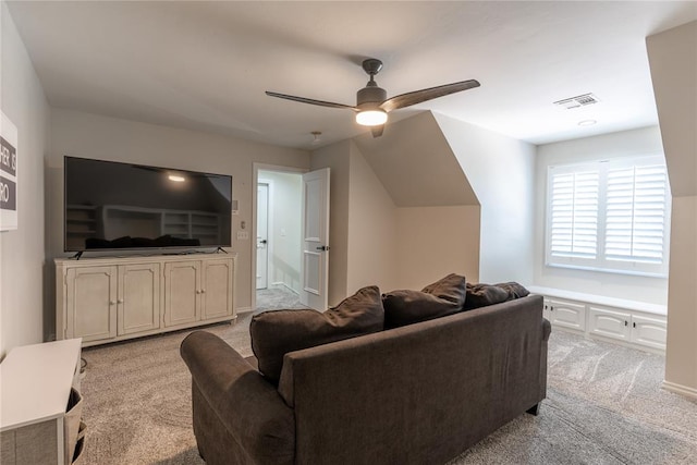 living room with ceiling fan and light colored carpet