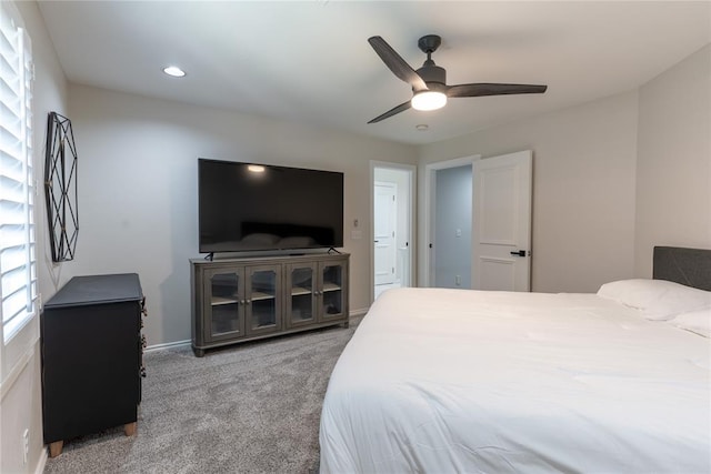 carpeted bedroom featuring ceiling fan