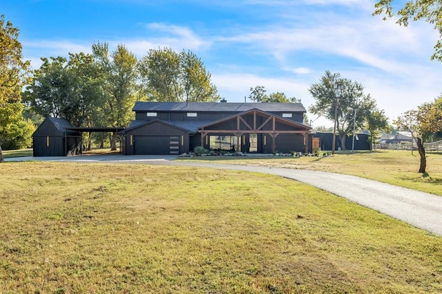 view of front of property featuring a garage and a front yard