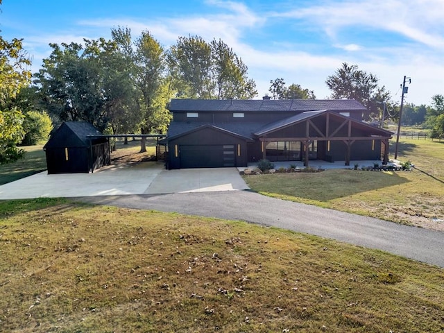 view of front of house with a garage and a front yard