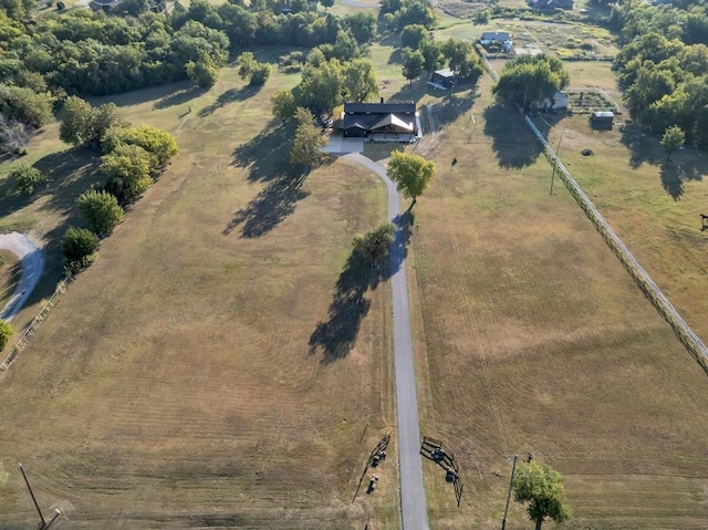 birds eye view of property featuring a rural view