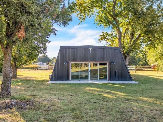 view of outbuilding with a lawn