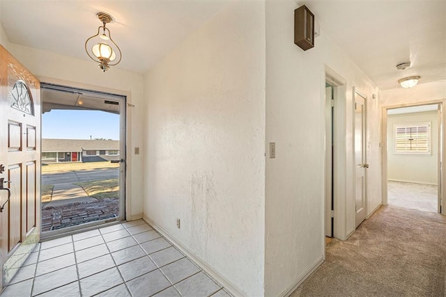 view of carpeted entrance foyer